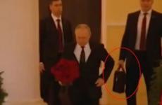 بوتين يحمل كرة القدم النووية.JPG