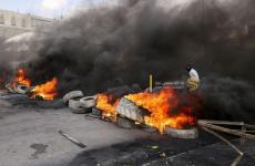 مواجهات في أريحا واشعال الاطارات المطاطية.jpg