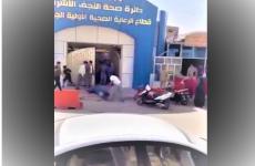 بالصور والفيديو جريمة سوق الأنصار في النجف العراقية رجل يذبح طفل في السوق.JPG