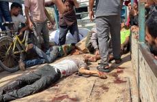 شهداء بمركز توزيع المساعدات في رفح.jpg