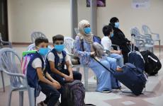 مسافرين معبر رفح أطفال كورونا