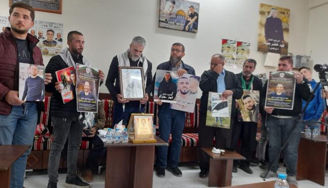 الجهاد تشارك في فعالية مُطالبة باسترداد جثامين الشهداء.jfif