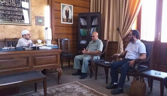 عضو المكتب السياسي لحركة الجهاد الإسلامي في فلسطين الدكتور وليد القططي، برئيس دائرة الإفتاء والتدريس الديني في مدينة حلب الدكتور محمود العكام لقاء.jfif