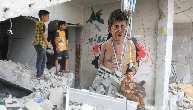 جداريات الاحتلال يقتل الطفولة (1).jpeg