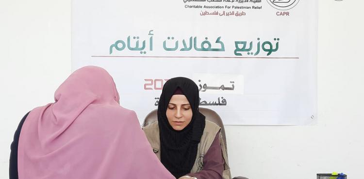 توزيع كفالة الأيتام.jpg