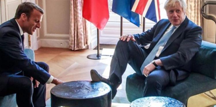 ماكرون ورئيس وزراء بريطانيا.png