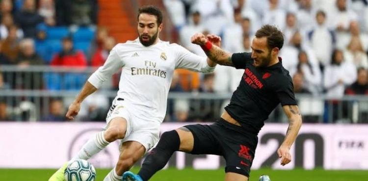 لاعبا ريال مدريد وإشبيلية.jpg