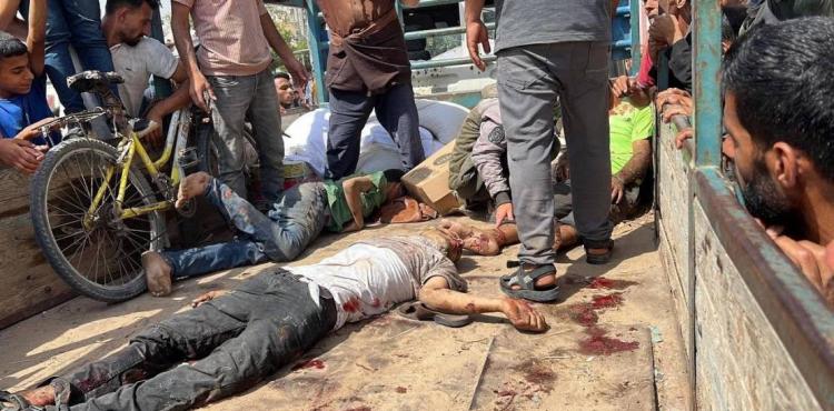 شهداء بمركز توزيع المساعدات في رفح.jpg