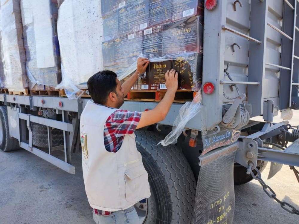 الاقتصاد بغزة فتح معبر كرم أبو سالم أمام البضائع التجارية.jpg